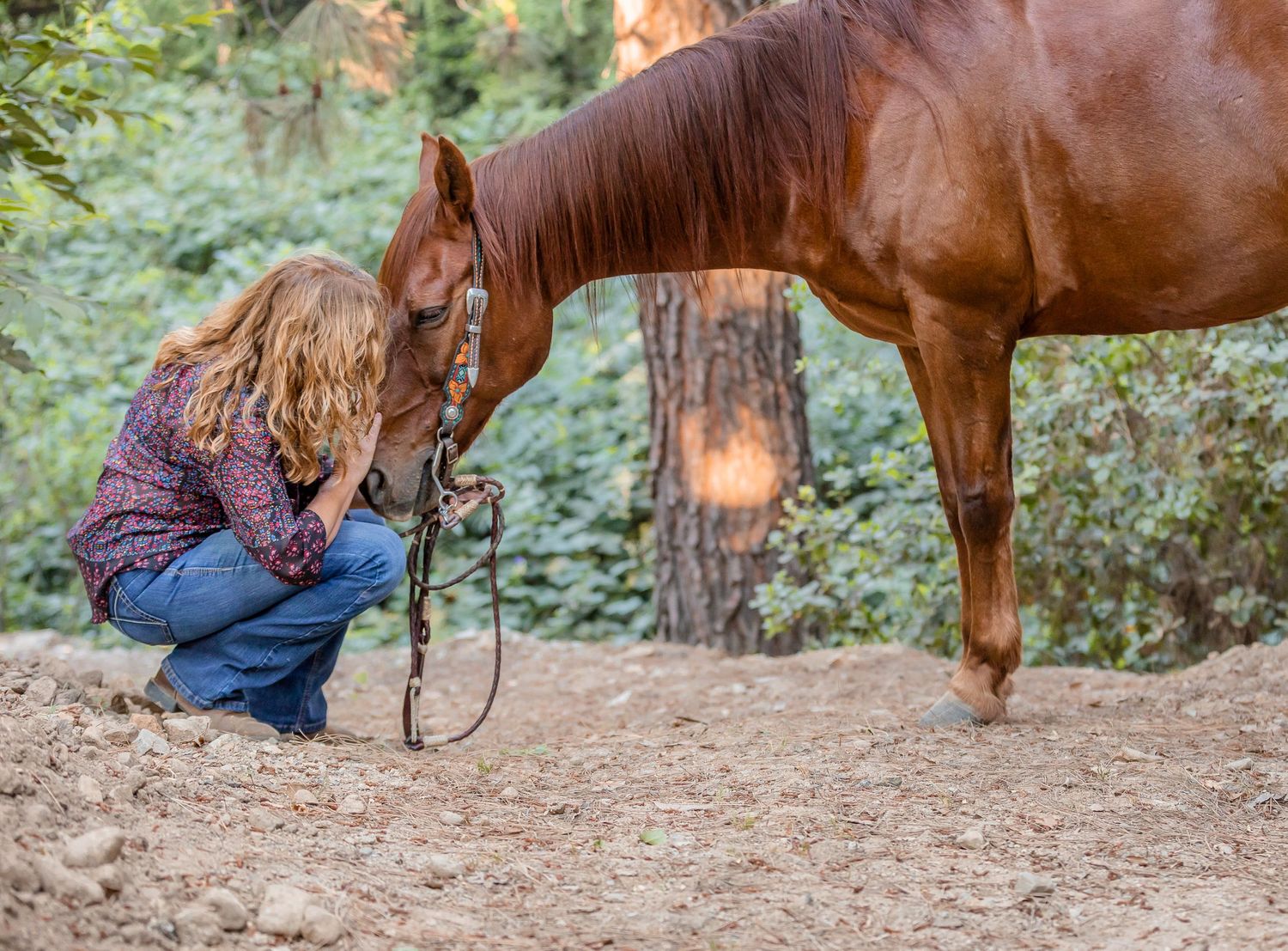 Owner kissing horse on face in Upland, California