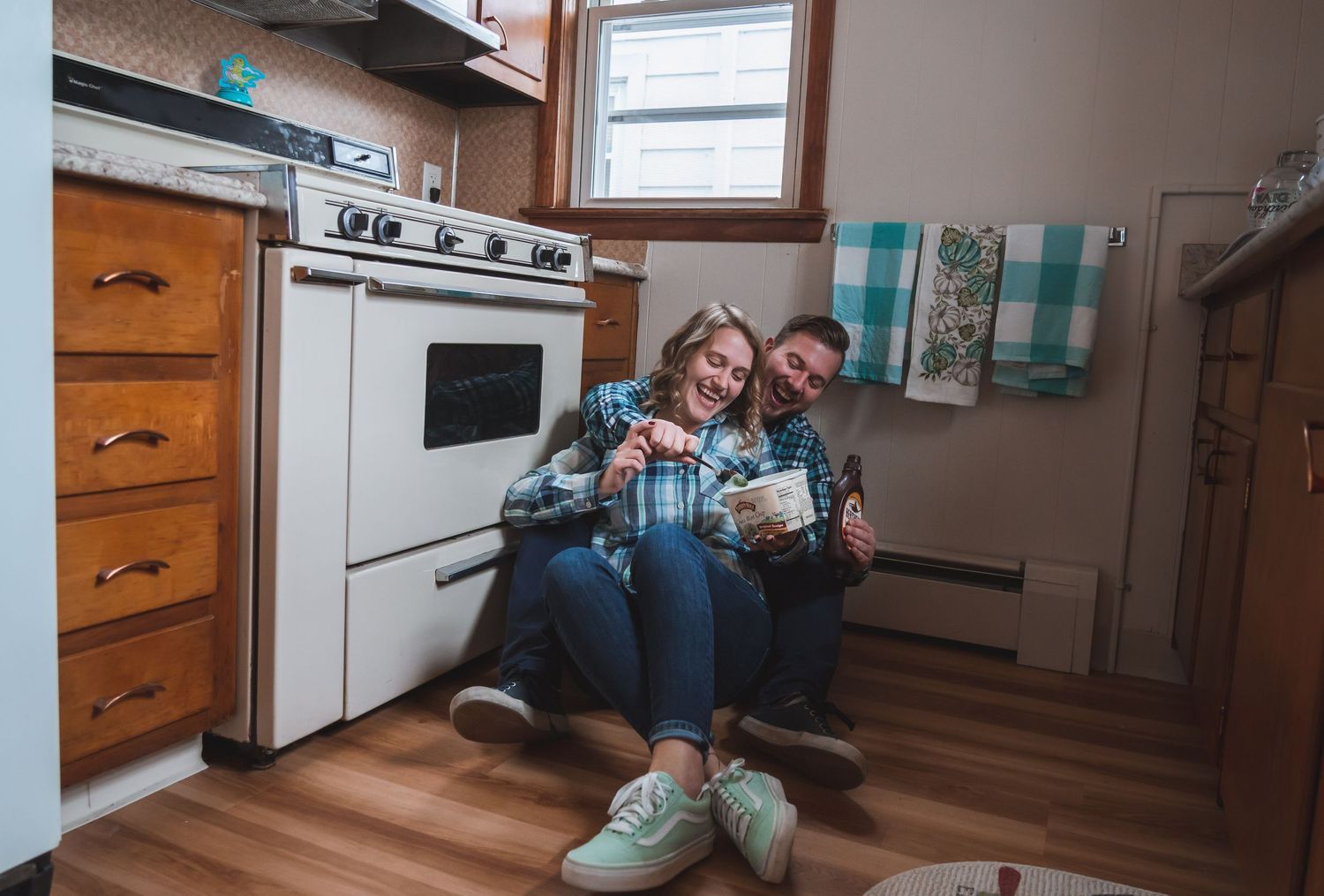 Engagement Couple from Lehigh Valley PA eating Ice cream in their kitchen