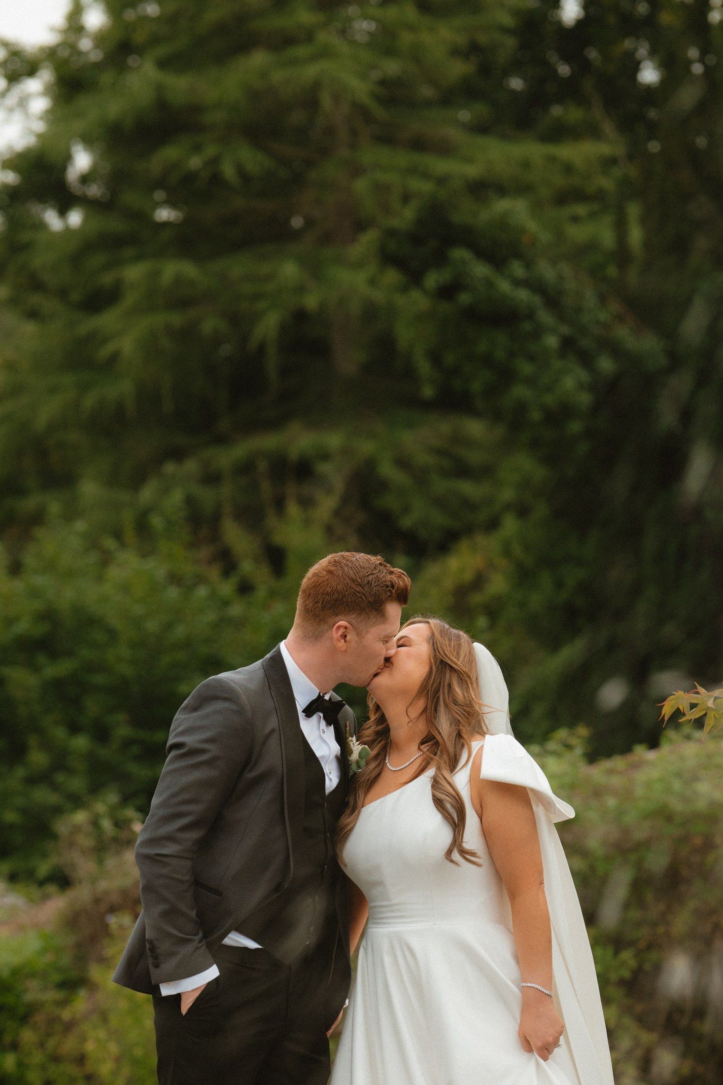 Sorcha and William together among the greenery at Castle Durrow on their wedding day.