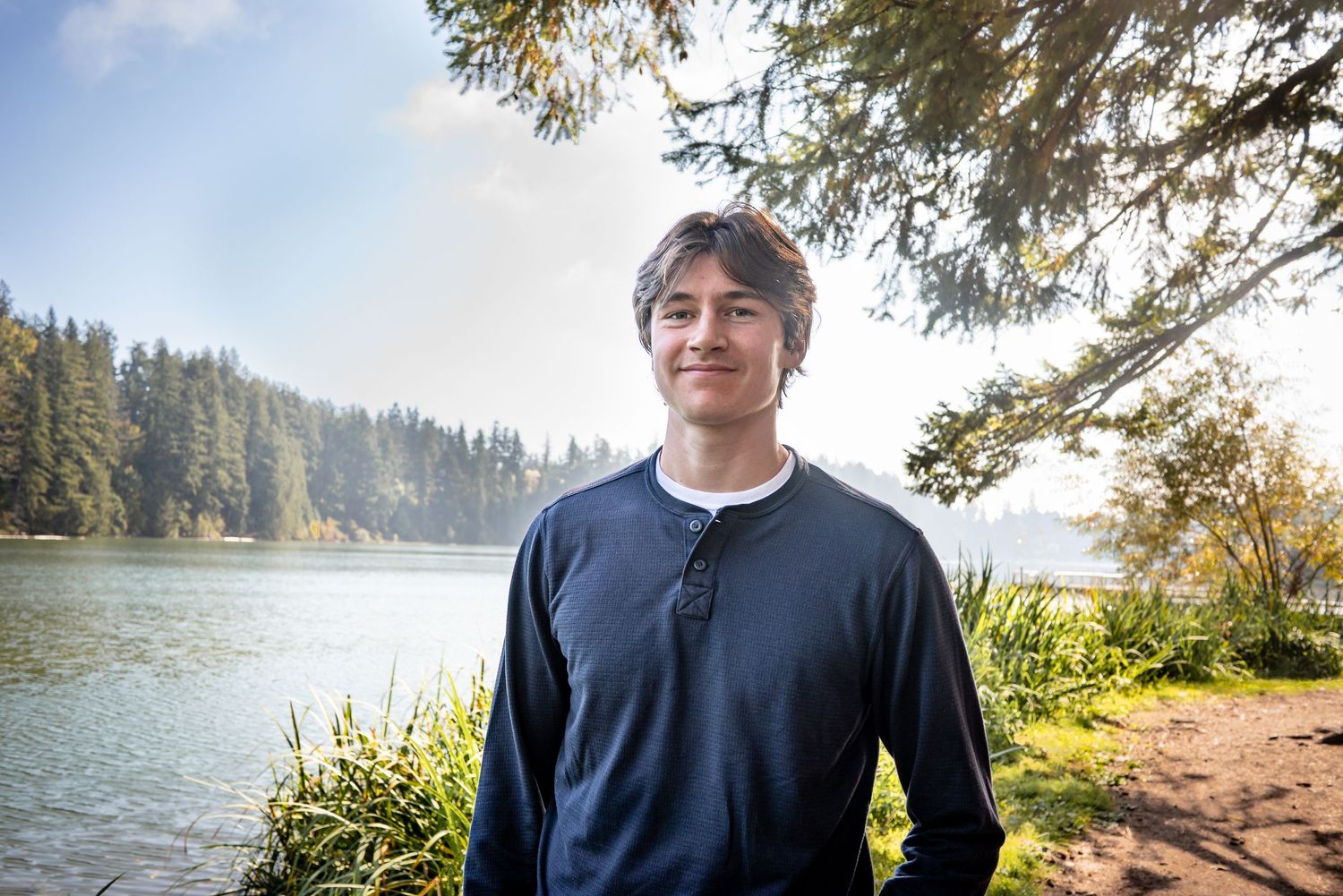 High school senior posing beside Lake Wilderness in Maple Valley