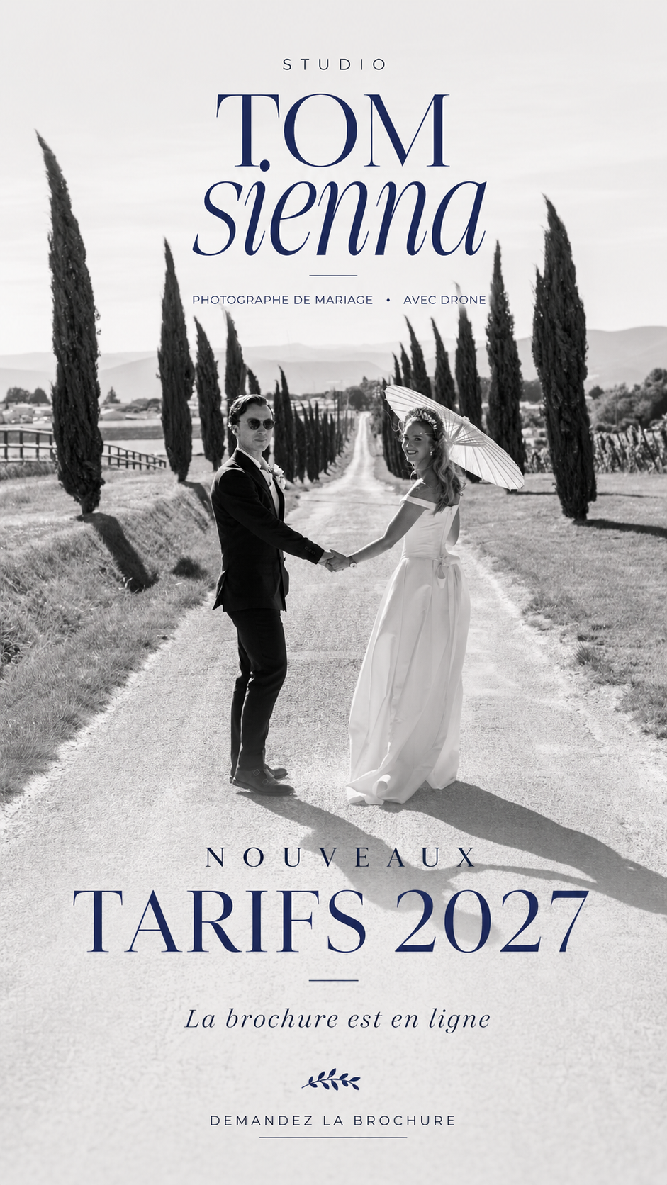 Black and white wedding photo of couple holding hands on a tree-lined road, promoting Studio Tom Sienna photography services.