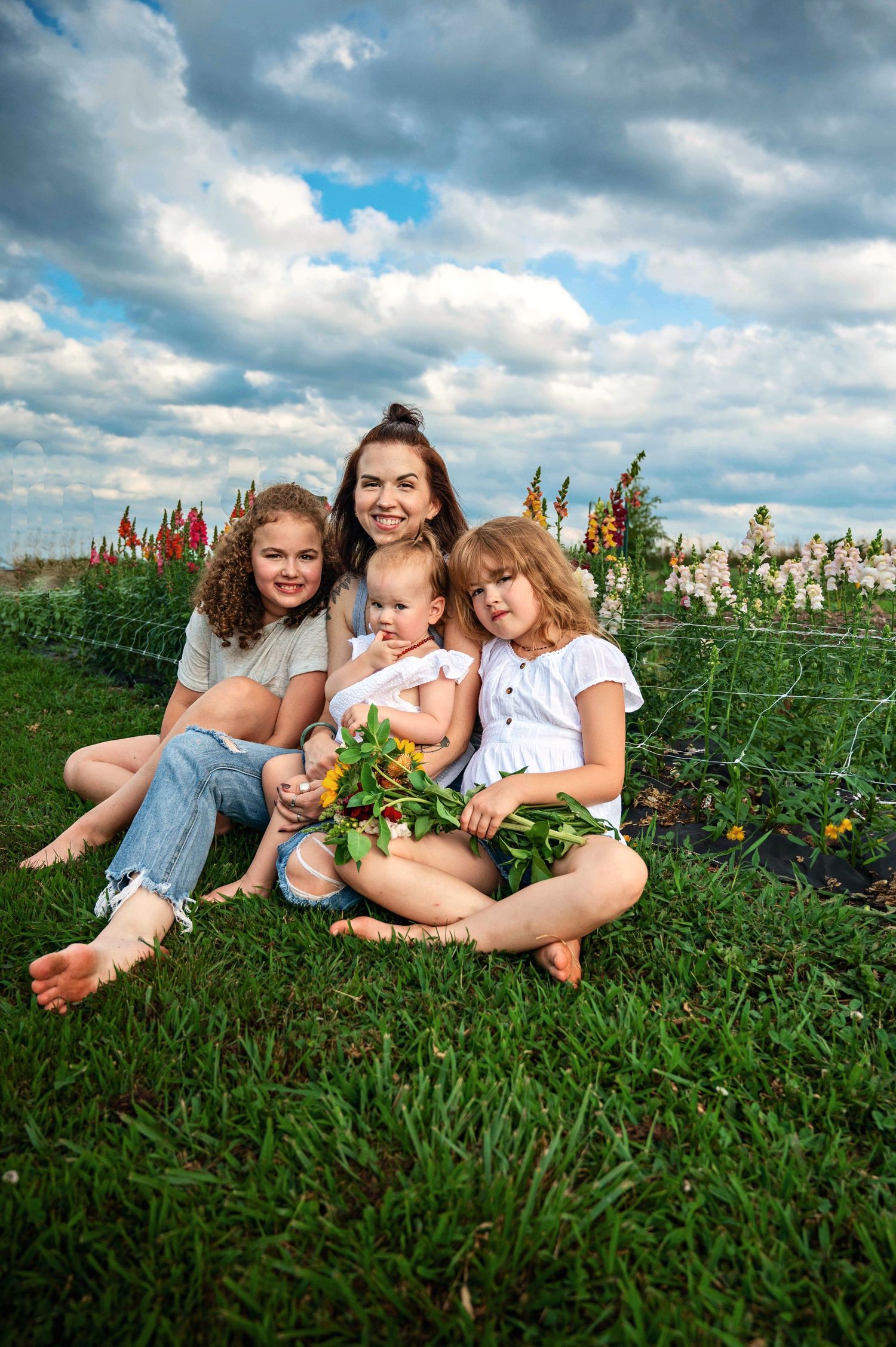 mom and daughters at flower feild