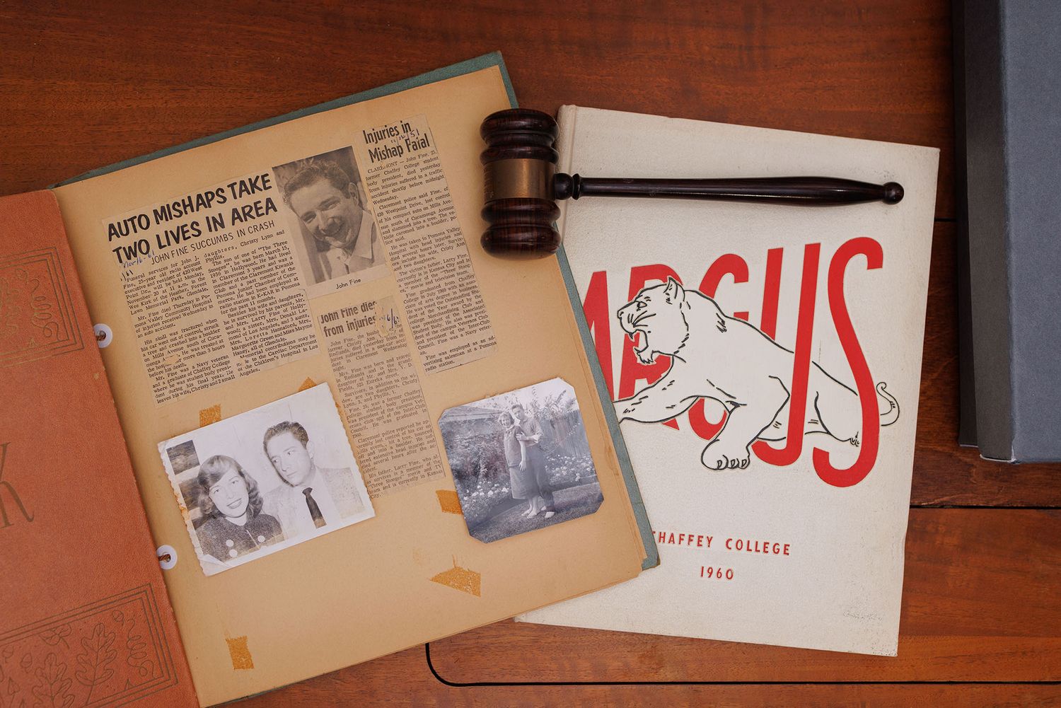 newspaper clipping, photographs, yearbook, and gavel