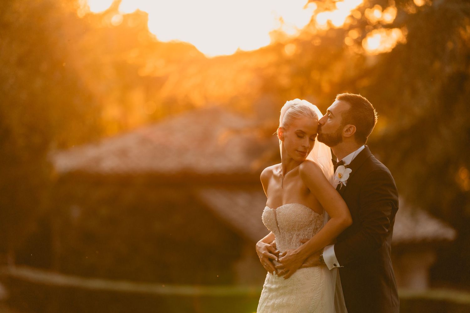 Golden hour wedding photography with dramatic sunset lighting.