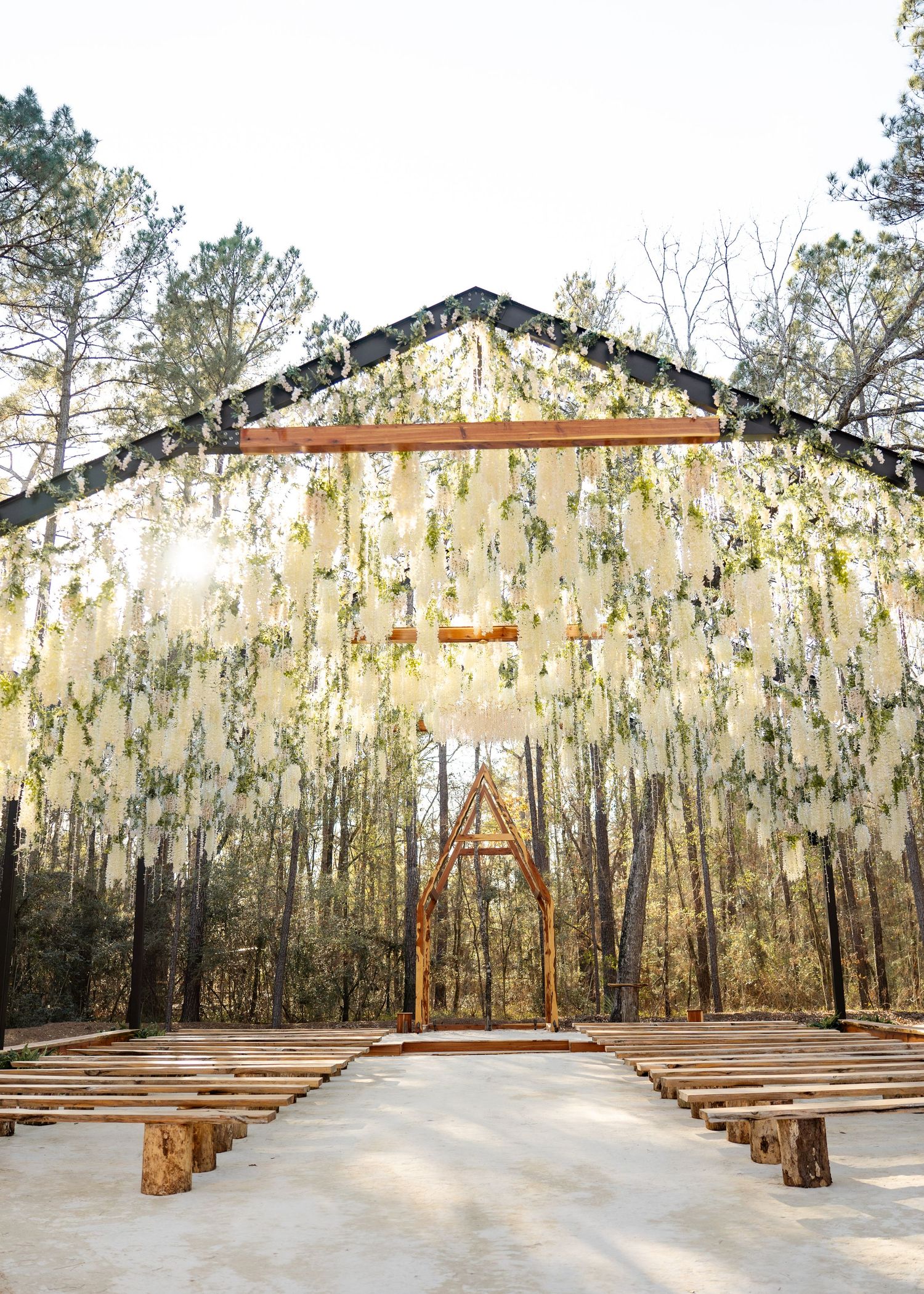 Twilight elopement ceremony of the Barrillas Family in Montgomery TX, with warm, moody light