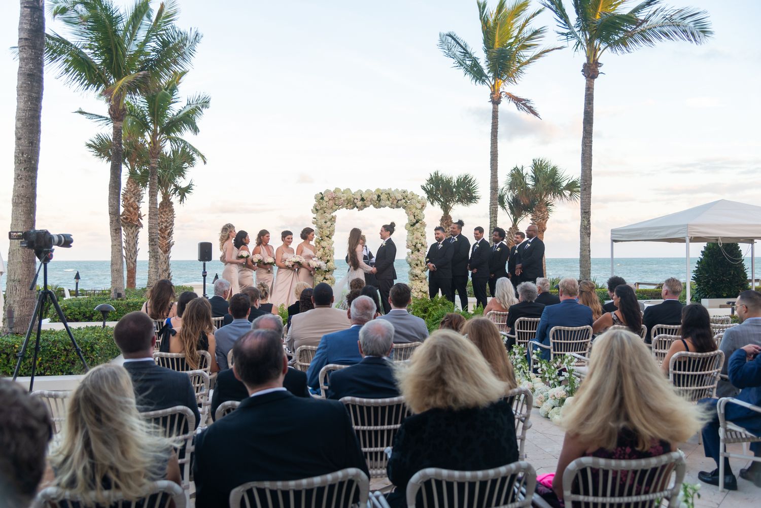 A sunset wedding ceremony on the beach captured by Treasure Coast wedding photographers.