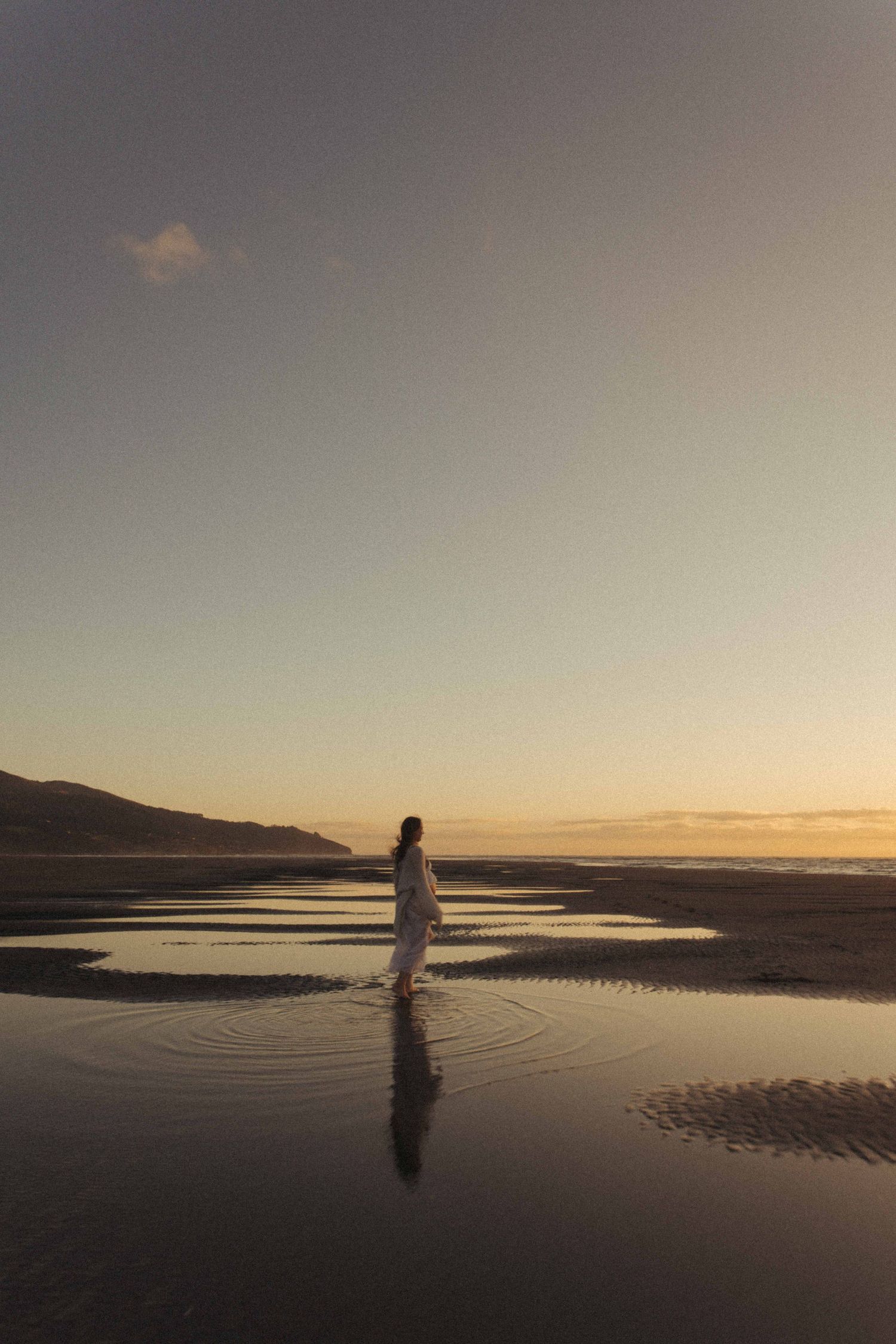 Pregnant woman during a maternity photoshoot in Raglan