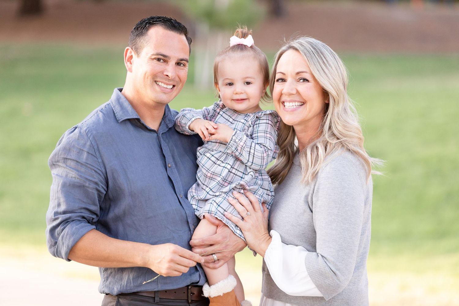 Young family outside in park photo