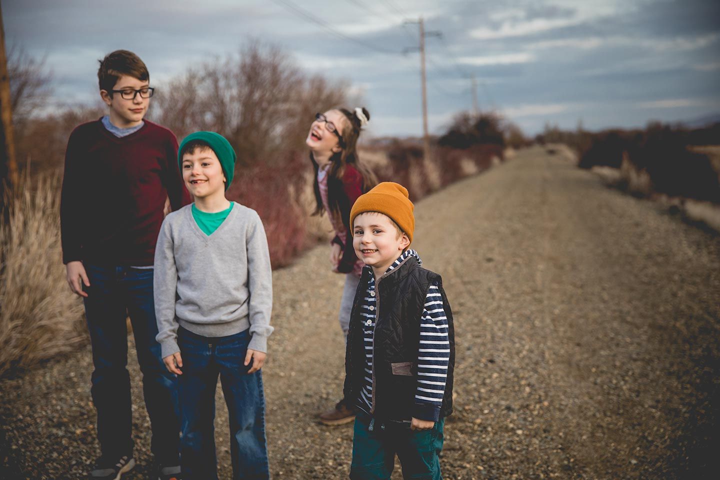 four siblings in sweater and beanies, walking on the John Wayne Trail in Ellensburg