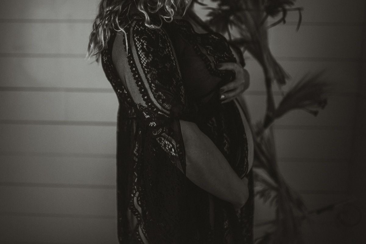 Dramatic black and white silhouette showing the curves of an elegant dress.