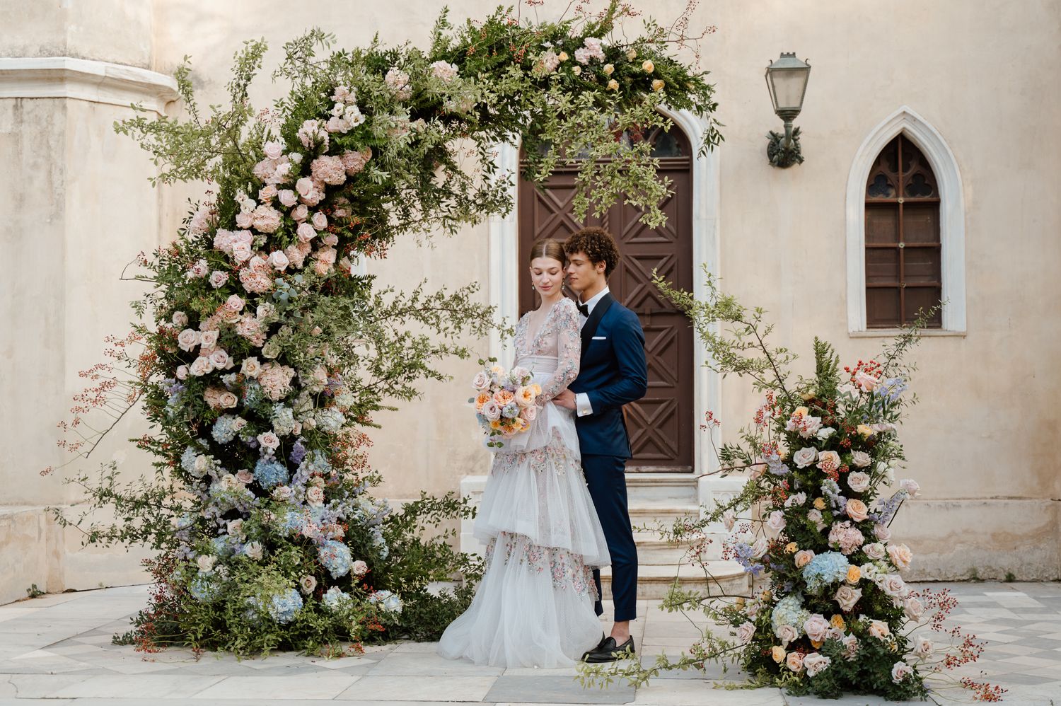 An artistic photo of a bride and groom at their whimsical garden wedding in Athens Greece