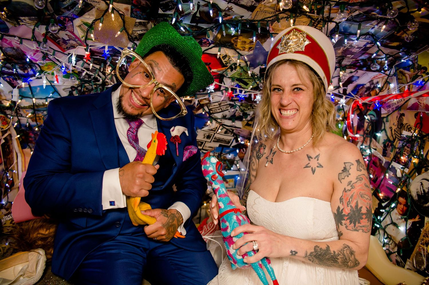 Newlyweds celebrate under colorful decorations at their wedding reception.