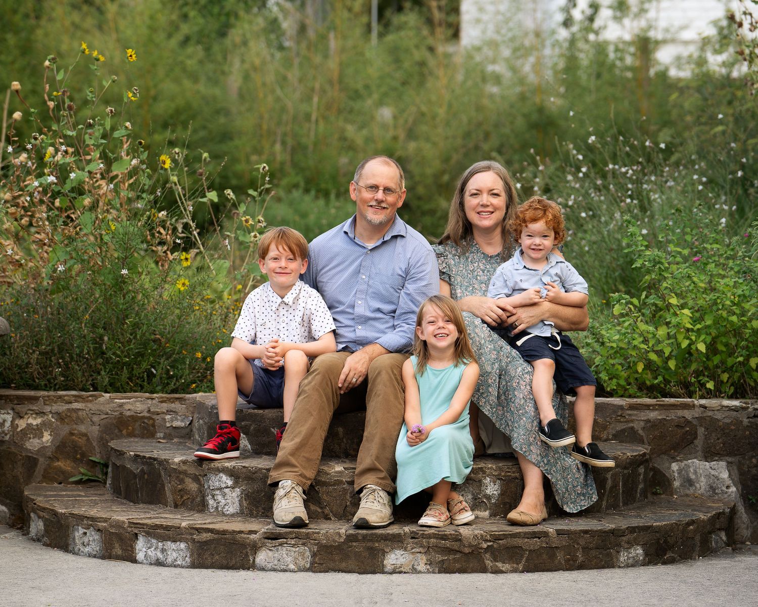 Landa Gardens at Landa Library San Antonio Texas family of five sitting on steps of garden smiling