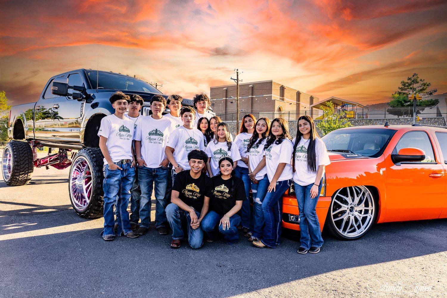 Car enthusiasts gather around a custom orange vehicle at sunset during a meetup event.