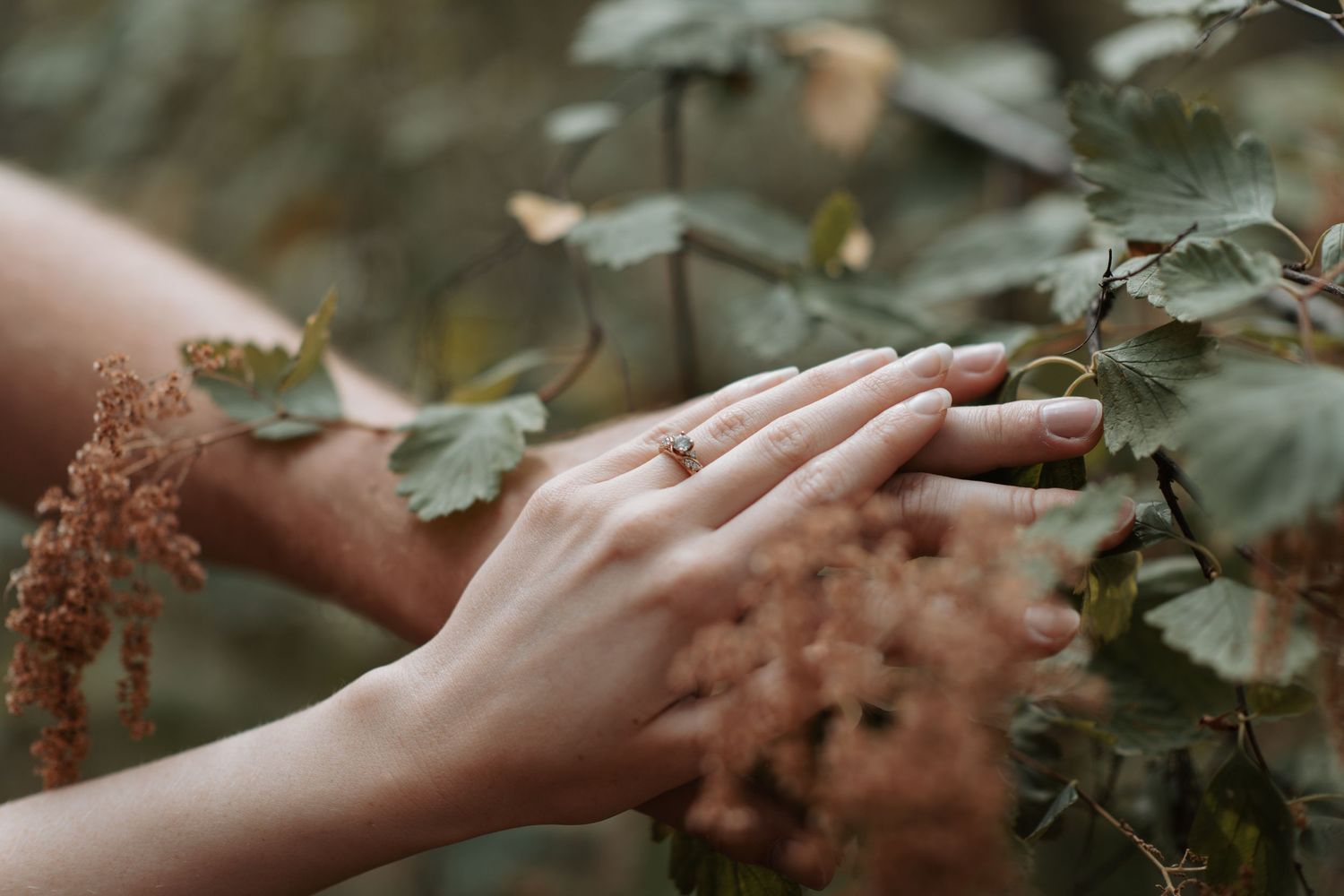 Close up image a ring on the hand of a young lady from her engagement session in Post Falls, Idaho at Kiwanis Park.