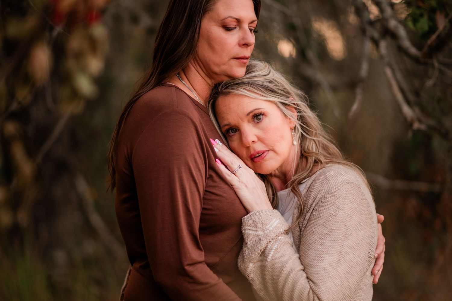 Intimate emotional moment captured in soft natural lighting.