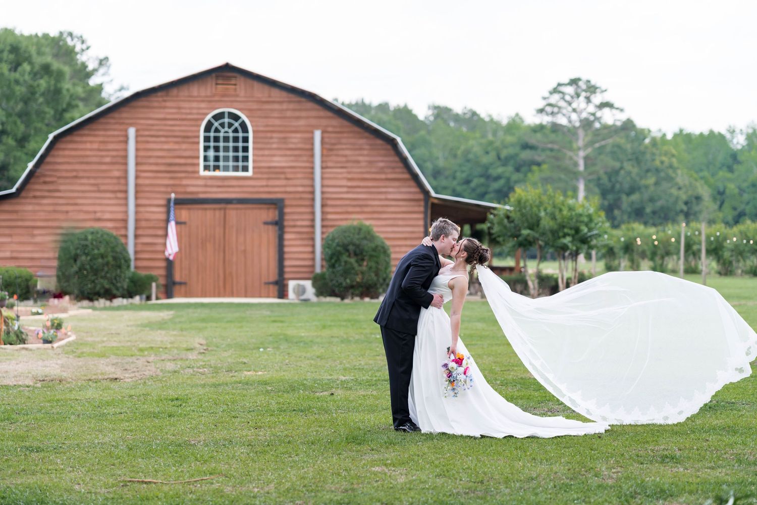 bride and groom in front of Hinton hollow barn in MS