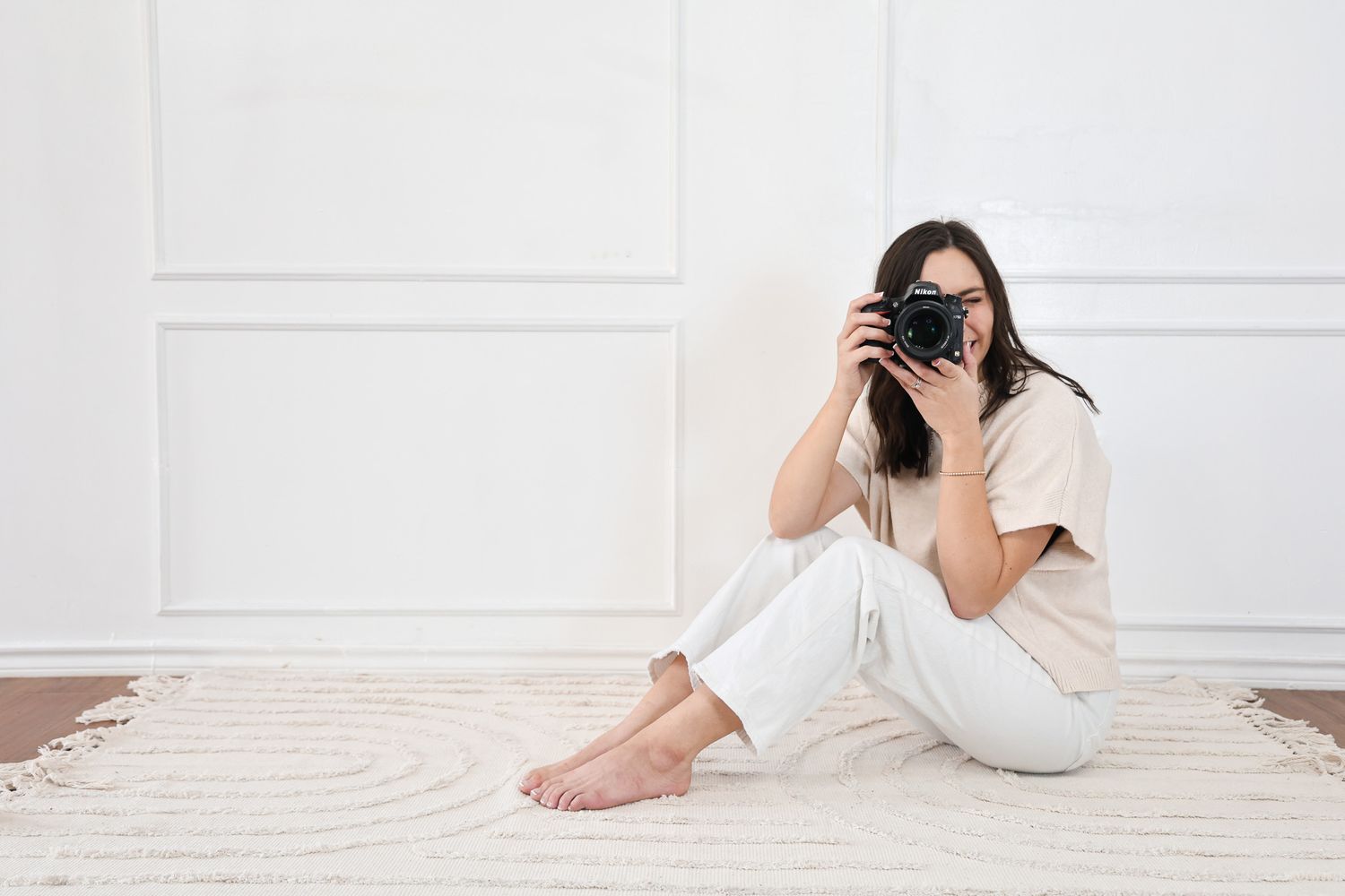 Central Texas Photographer sits with her camera in Temple, Texas.
