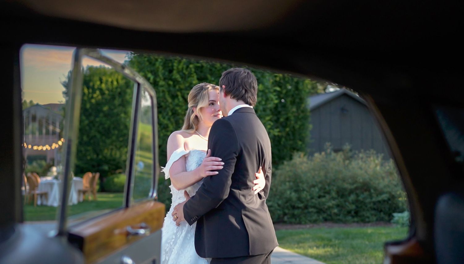 Elegant wedding couple sharing a kiss framed by ohio wedding photographer sassi photo