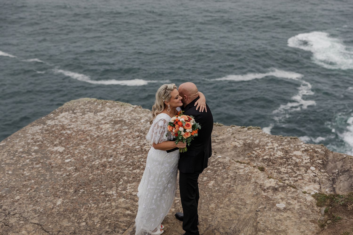 US couple eloping at Hags Head, Cliffs of Moher, Ireland.