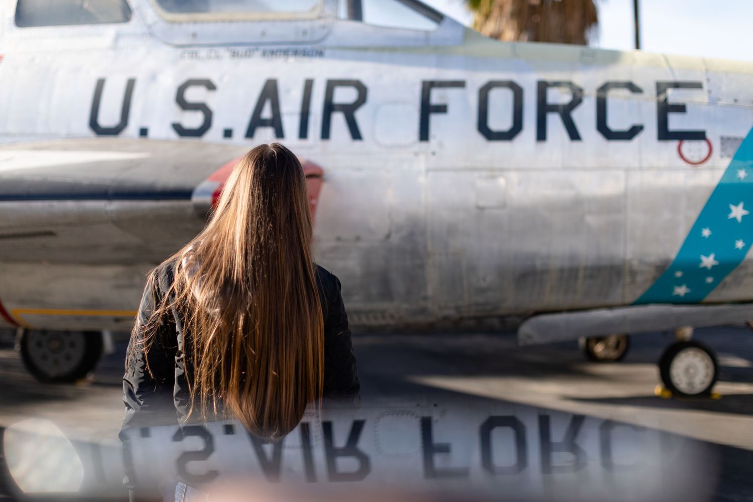 16 year old girl looking at a U.S. Air Force plane