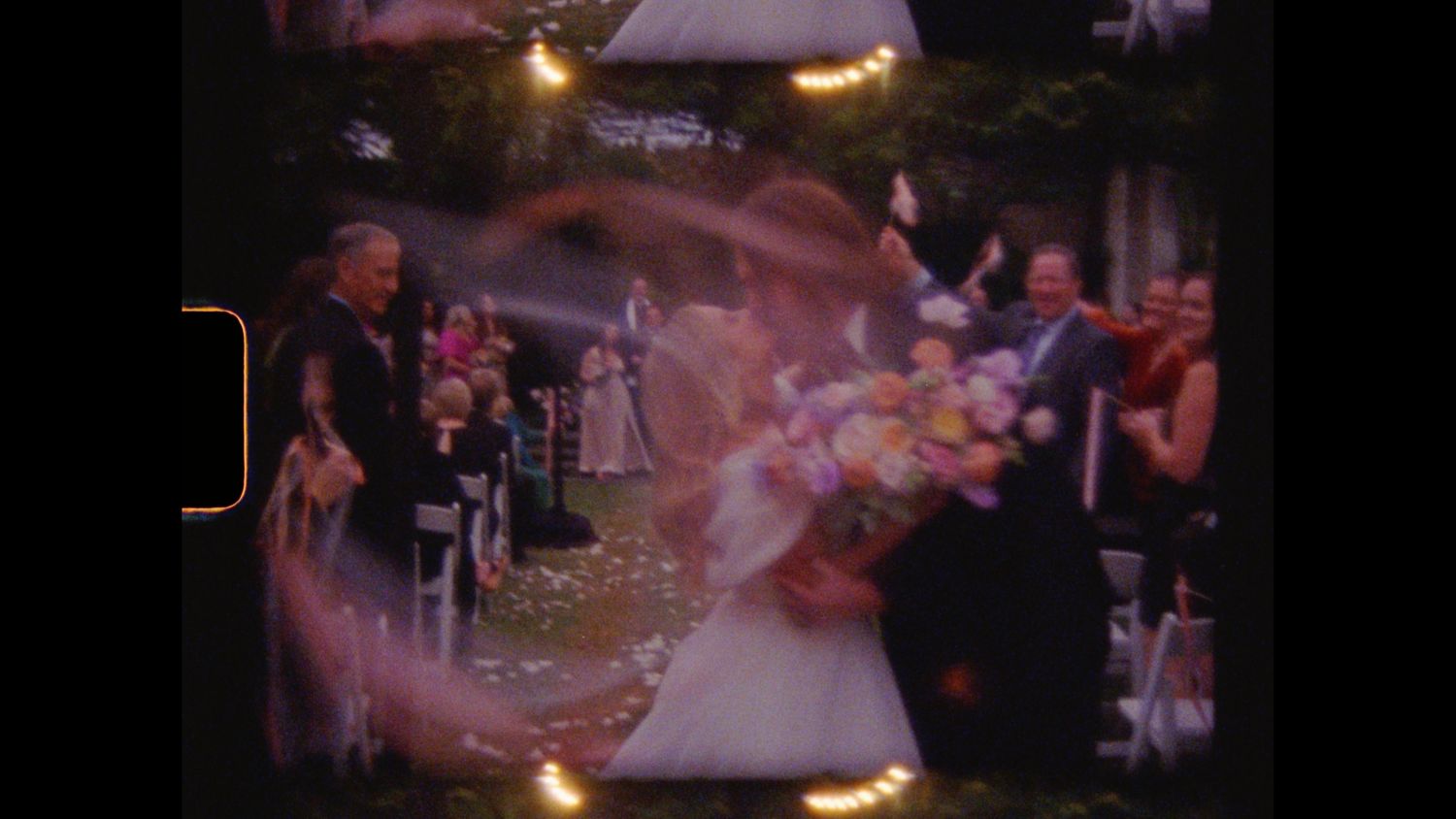 groom and. bride kissing around confetti outside