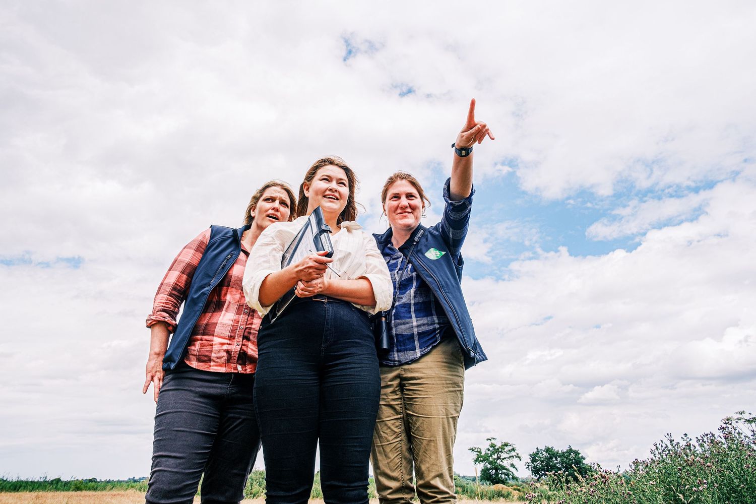 Suffolk Wildlife Trust staff photographed in a wildflower meadow in Suffolk by commercial and documentary photographer John Ferguson.
