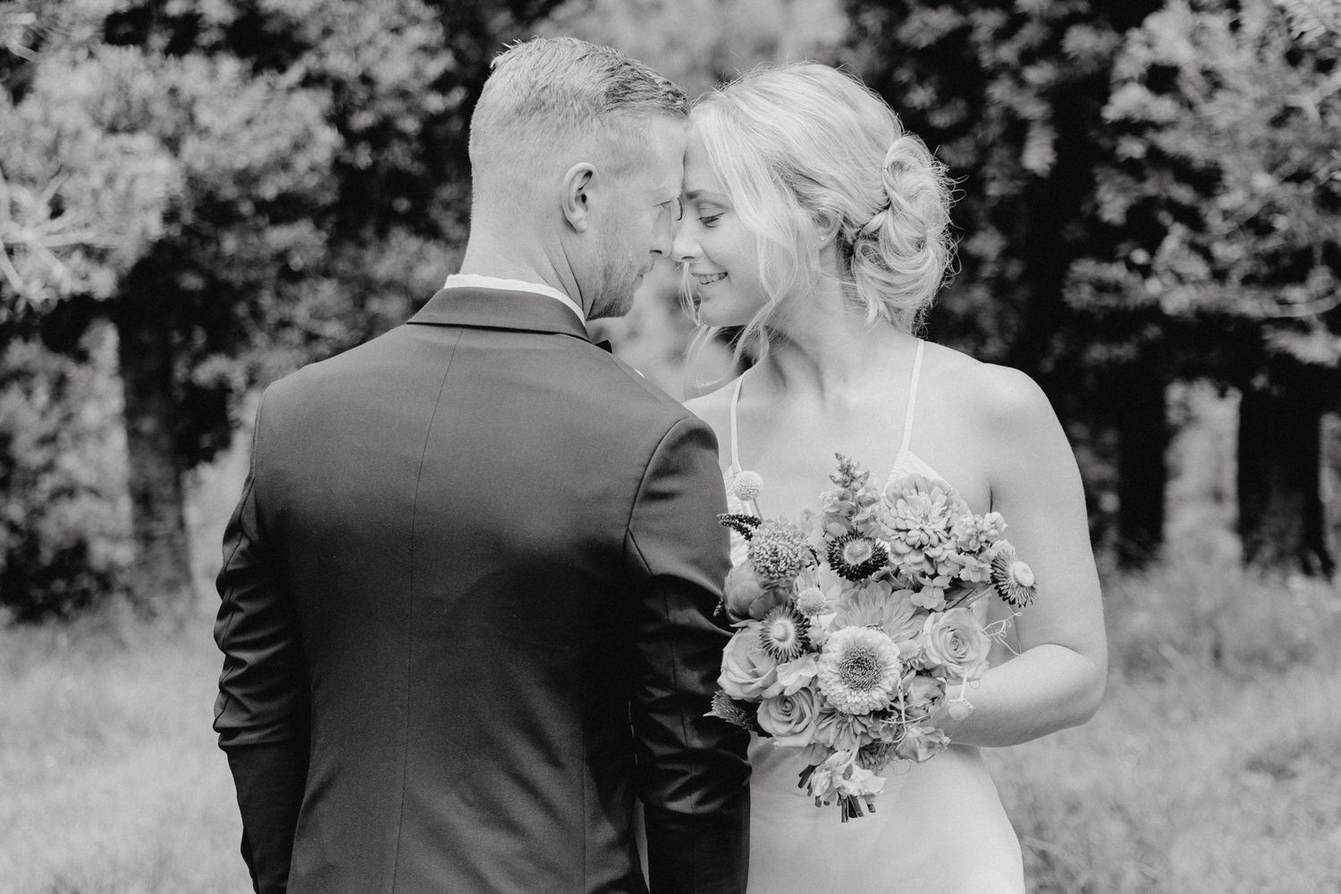 A couple during their backyard wedding photoshoot with Apertured Media Auckland Wedding Photographer