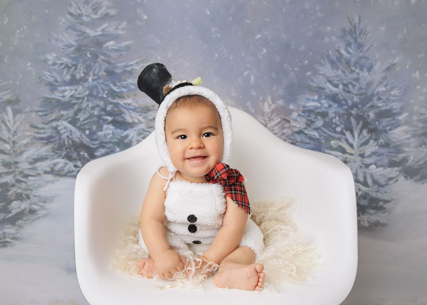 Baby sitting portrait in winter holiday setup photographed in Austin newborn photography studio