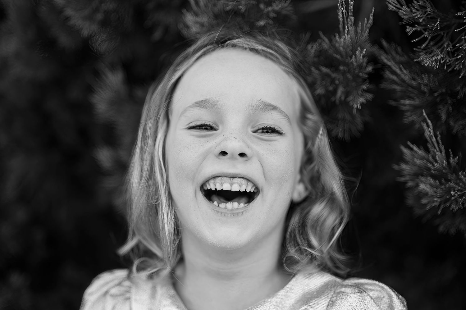 A joyful black and white portrait of pure happiness and laughter.