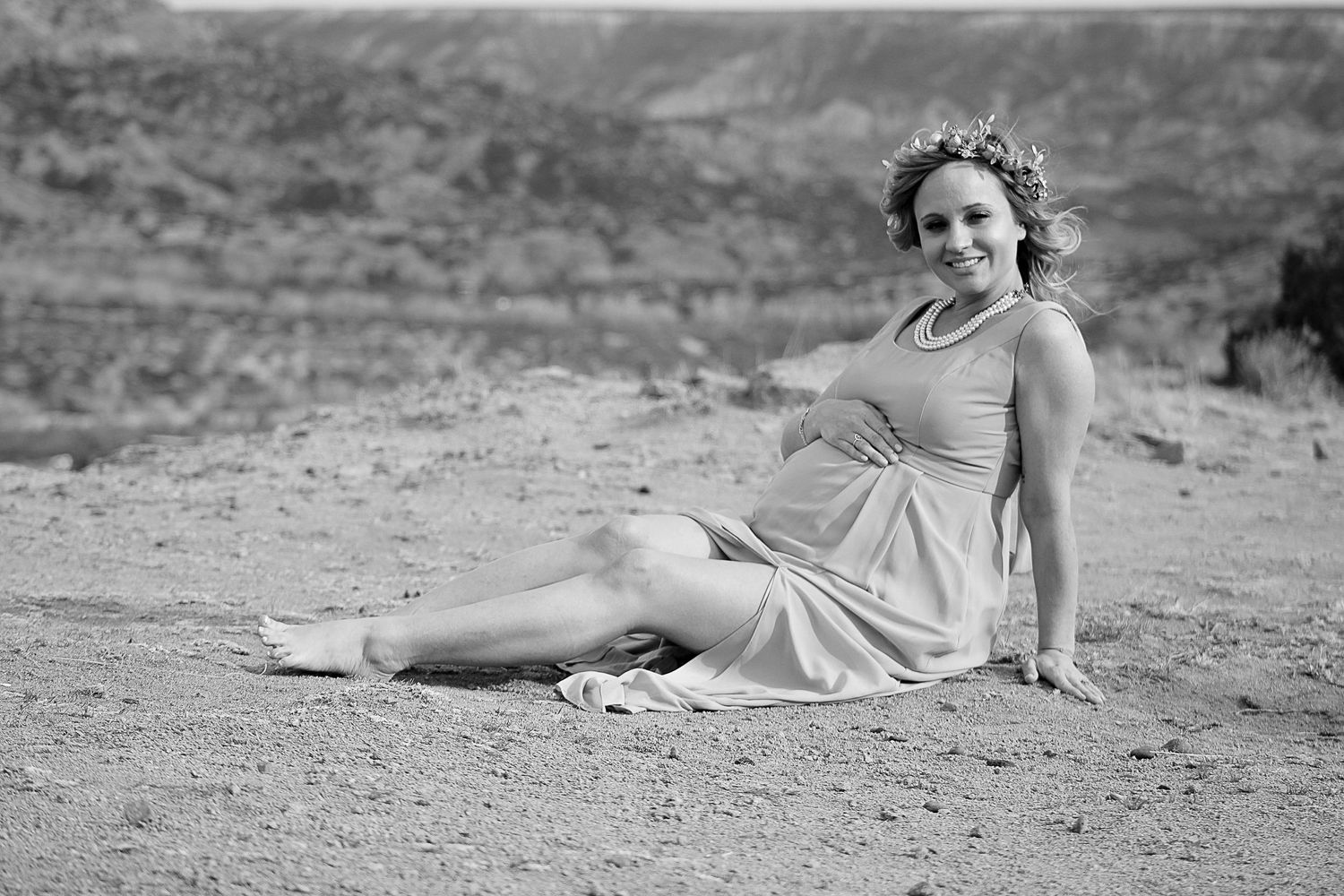 An expecting mother during a maternity photo session at Palo Duro Canyon state park in Canyon, Texas