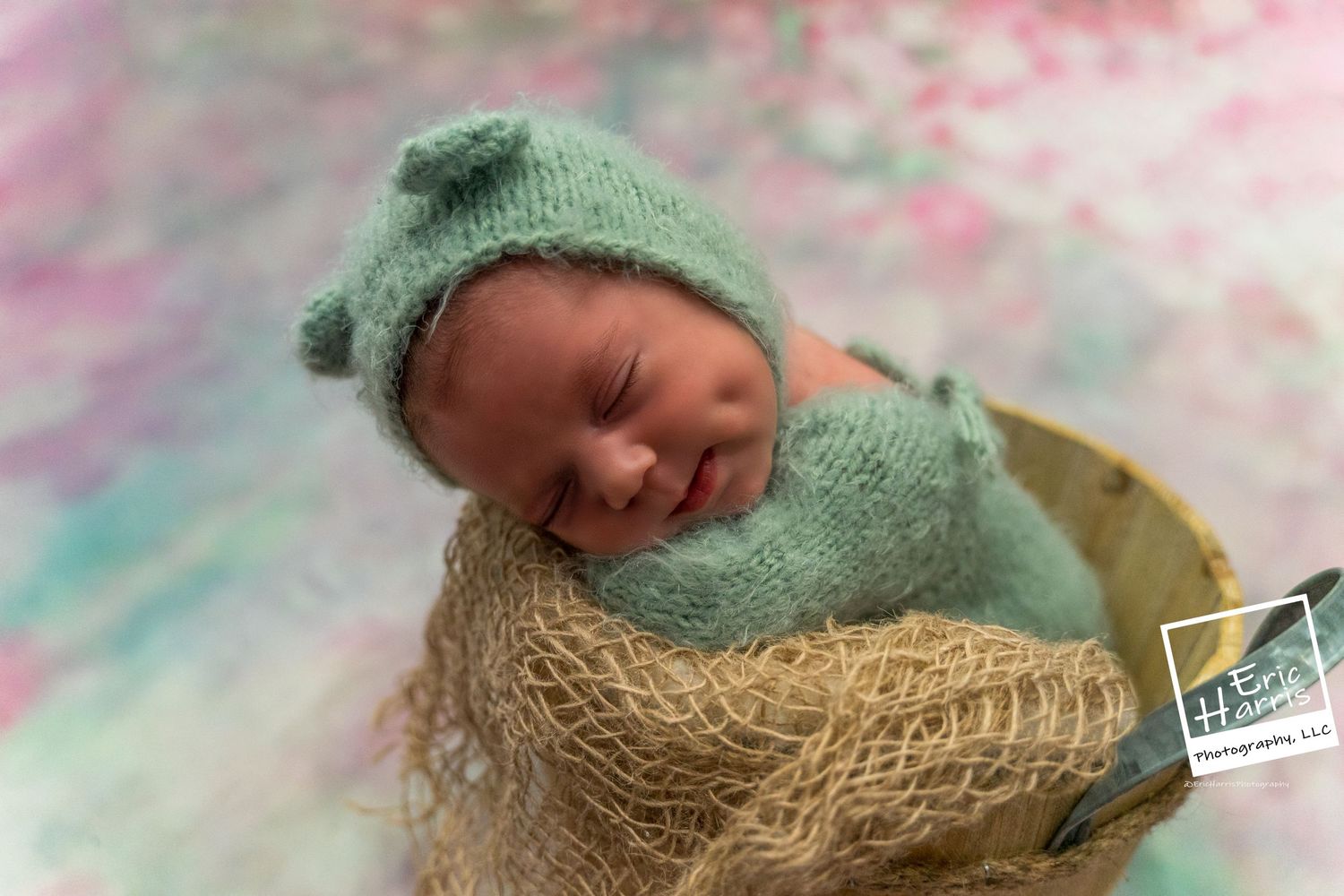 baby girl in a sweet bear hat posed in a bucket
