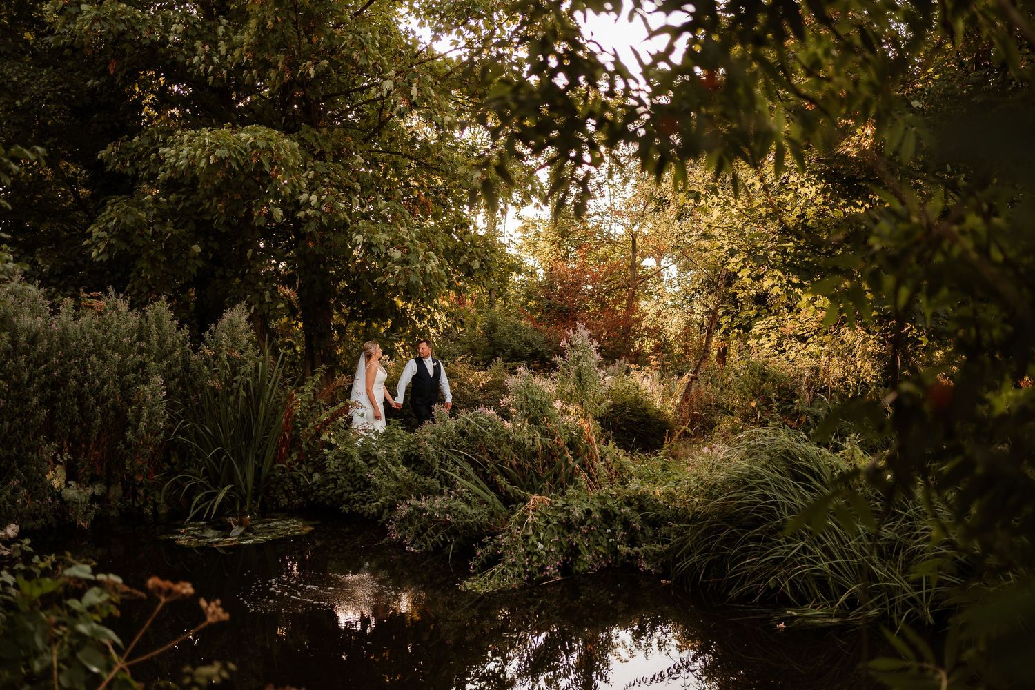 Golden hour couple photos in the garden at an elegant Kingston Country Courtyard wedding
