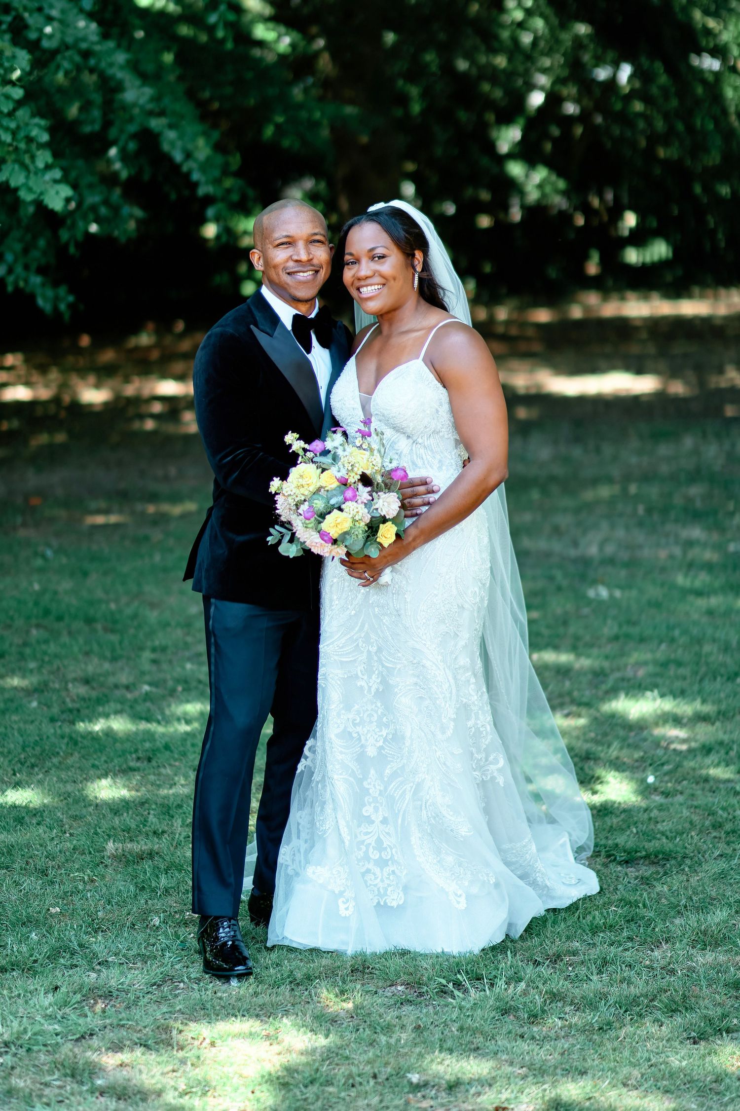 Oakwood House Maidstone gardens with wedding couple