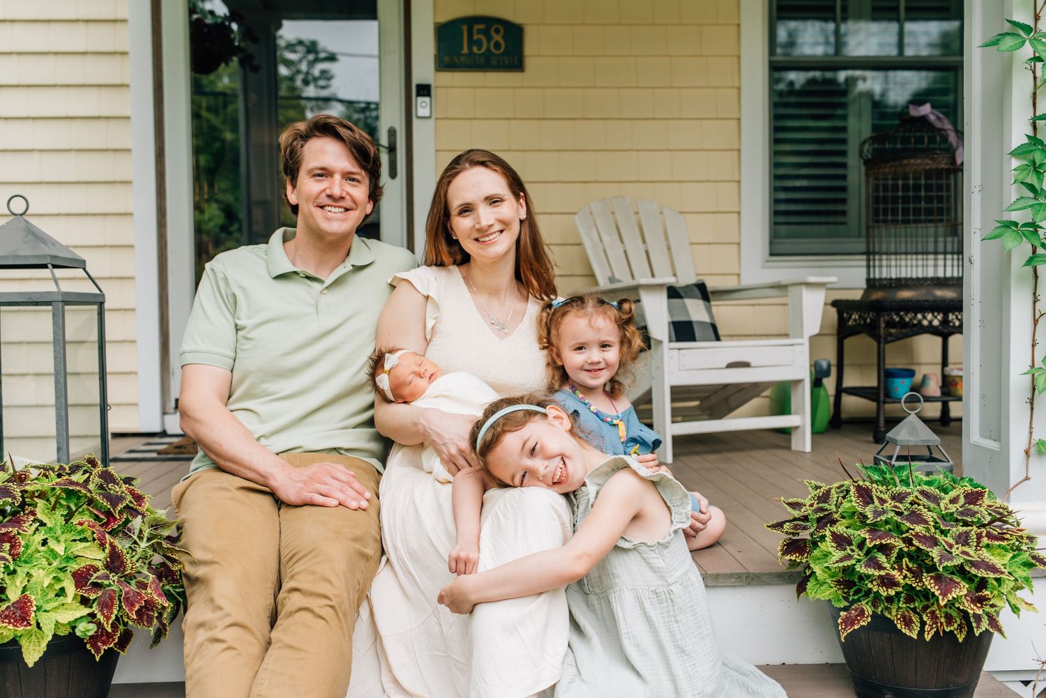 in-home newborn photography session outdoors on a beautiful plant filled porch in Atlantic Highlands, NJ
