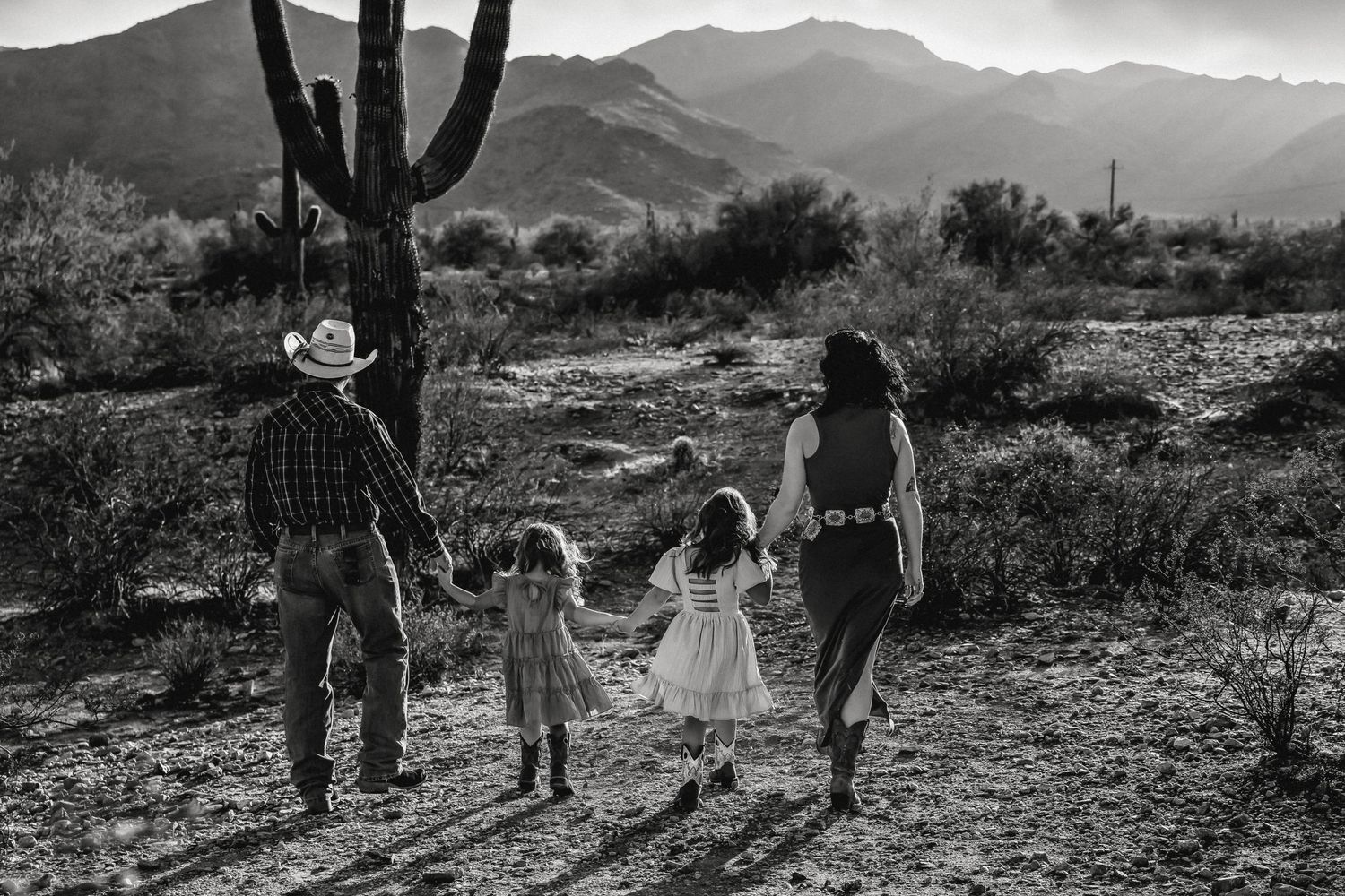 Historical images of the American Southwest desert landscape with saguaro cacti and mountains in black and white film.