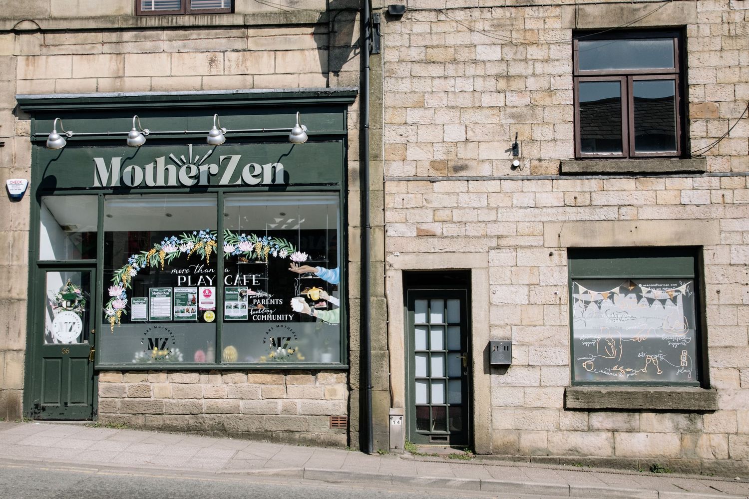 The exterior of Mother Zen store features a rustic brick facade with vintage window displays and green signage.