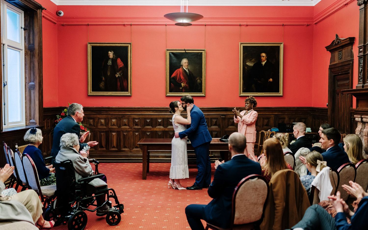 Couple sharing first kiss at Corn Street Registry office wedding ceremony.