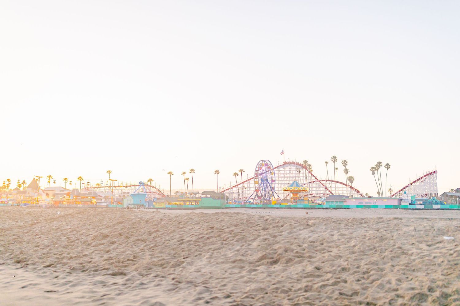 Santa Cruz Boardwalk at Sunset captured by Chelsee Rawe Photography