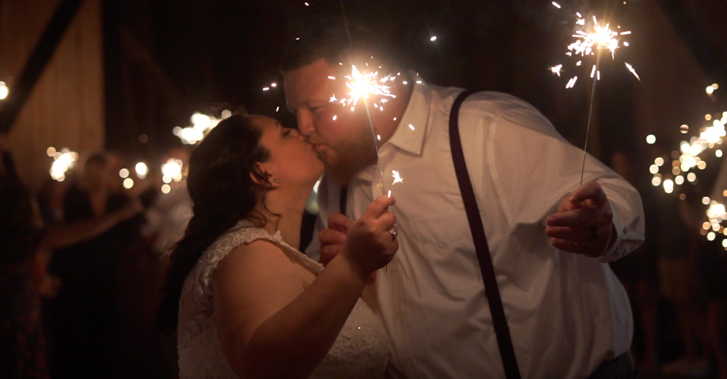 Sparklers create magical light trails during a nighttime celebration.