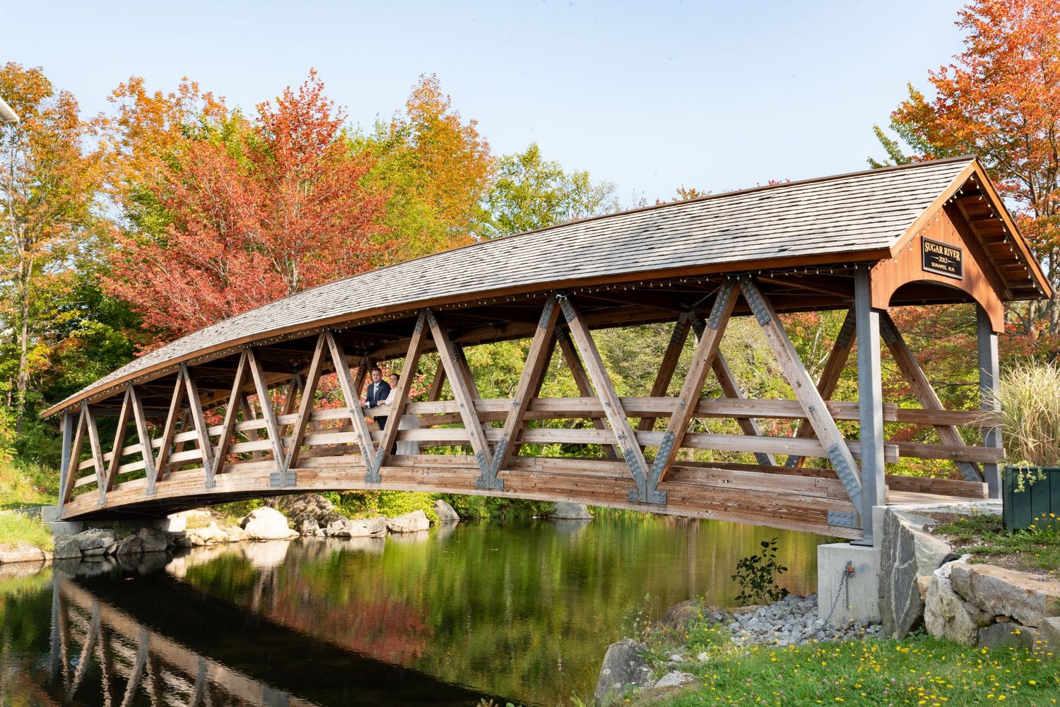 Fall Foliage wedding portraits on Sugar River covered bridge Sunapee, NH Leah Ramuglia photography bride groom wedding