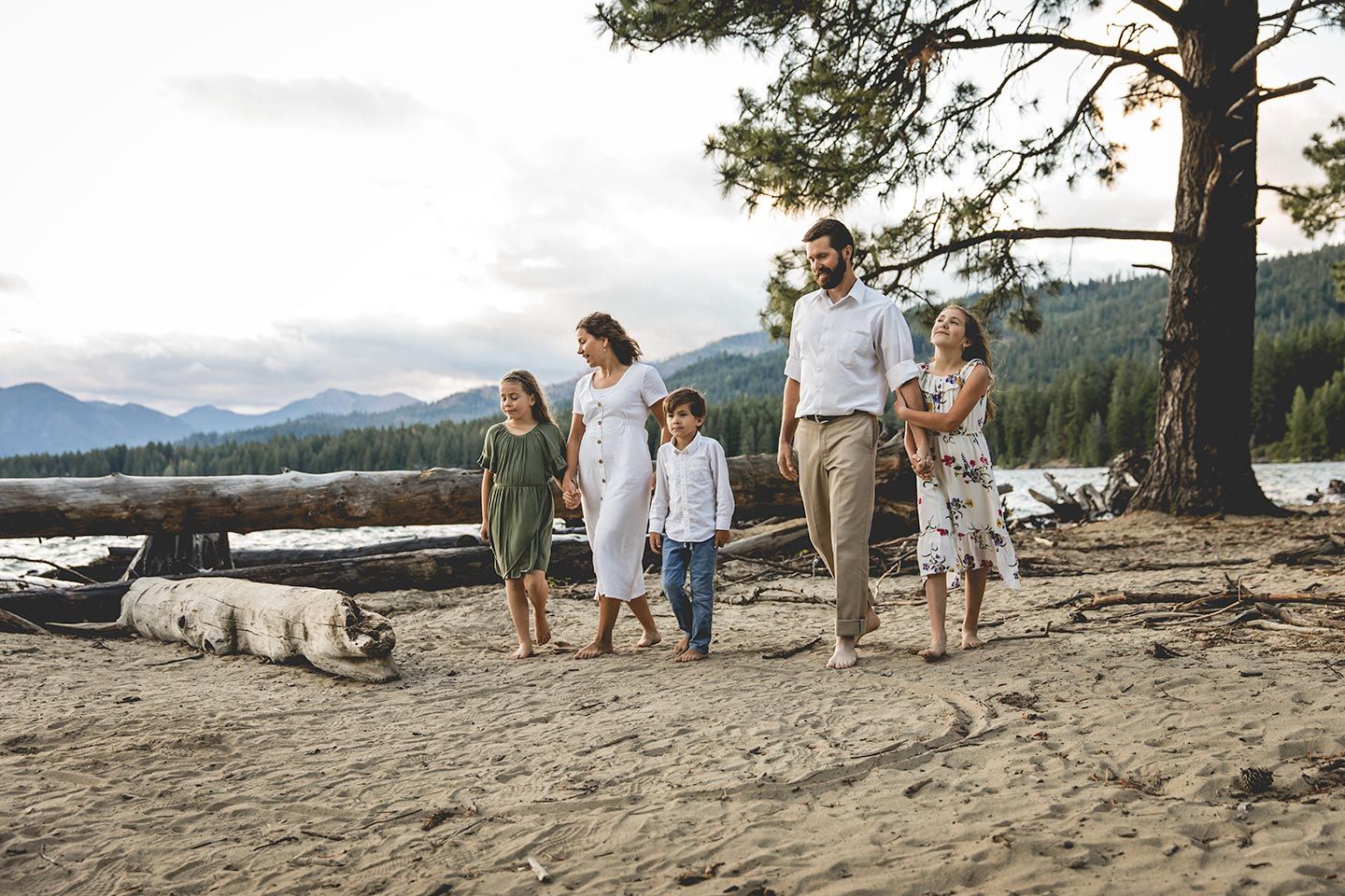 family walking together on the beach at cle elum lake