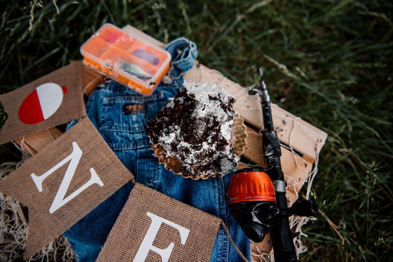 Rustic wooden blocks with letters scattered on dark textured surface.