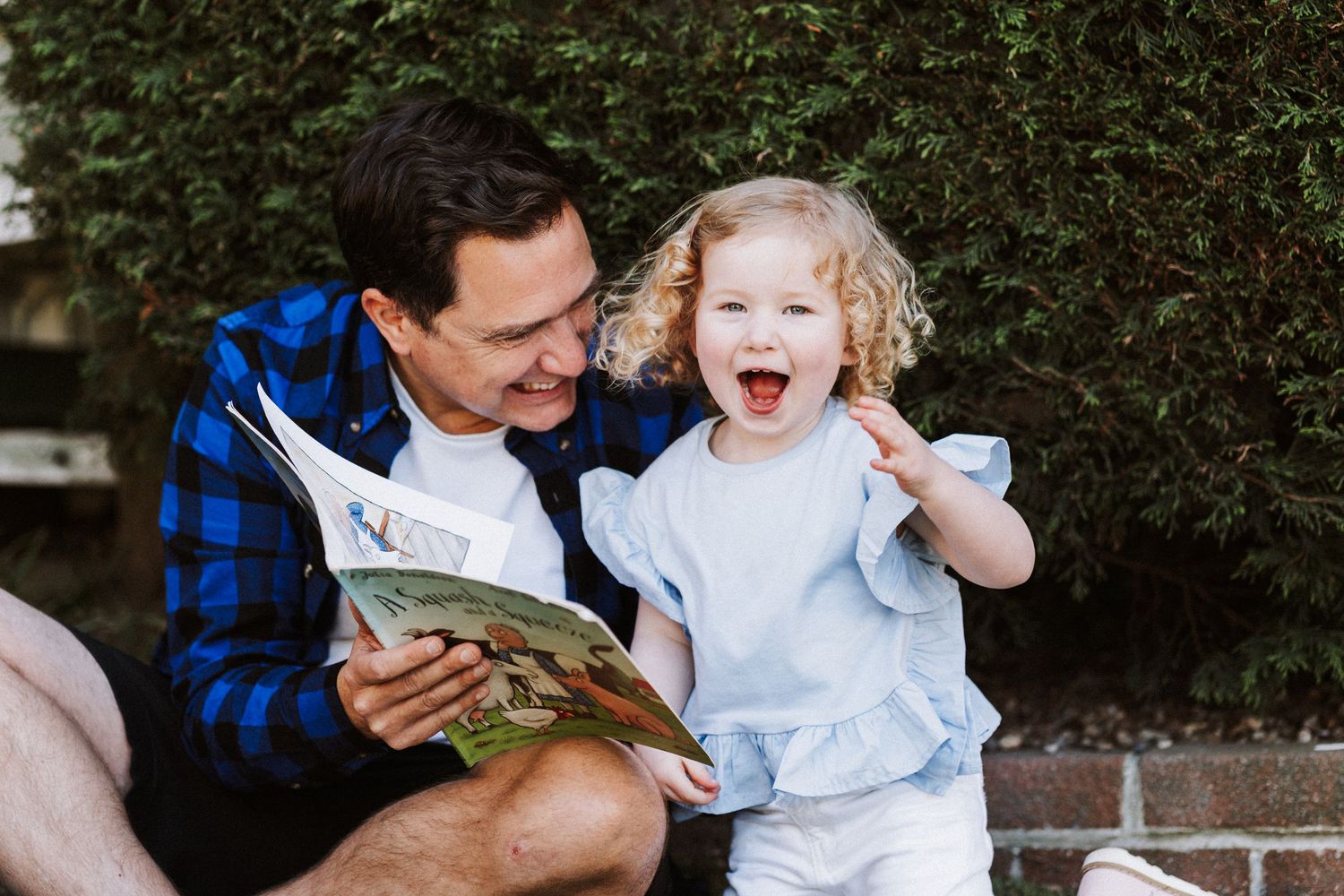 A collection of black and white photos showing candid moments at a family gathering or celebration.