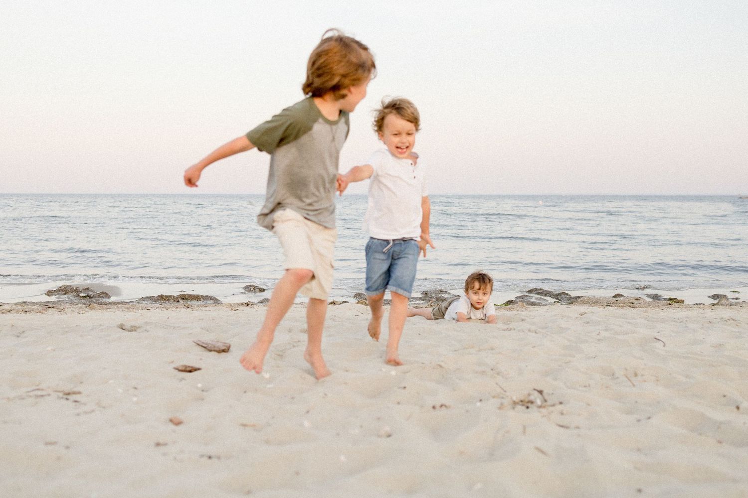 Boys running on the beach