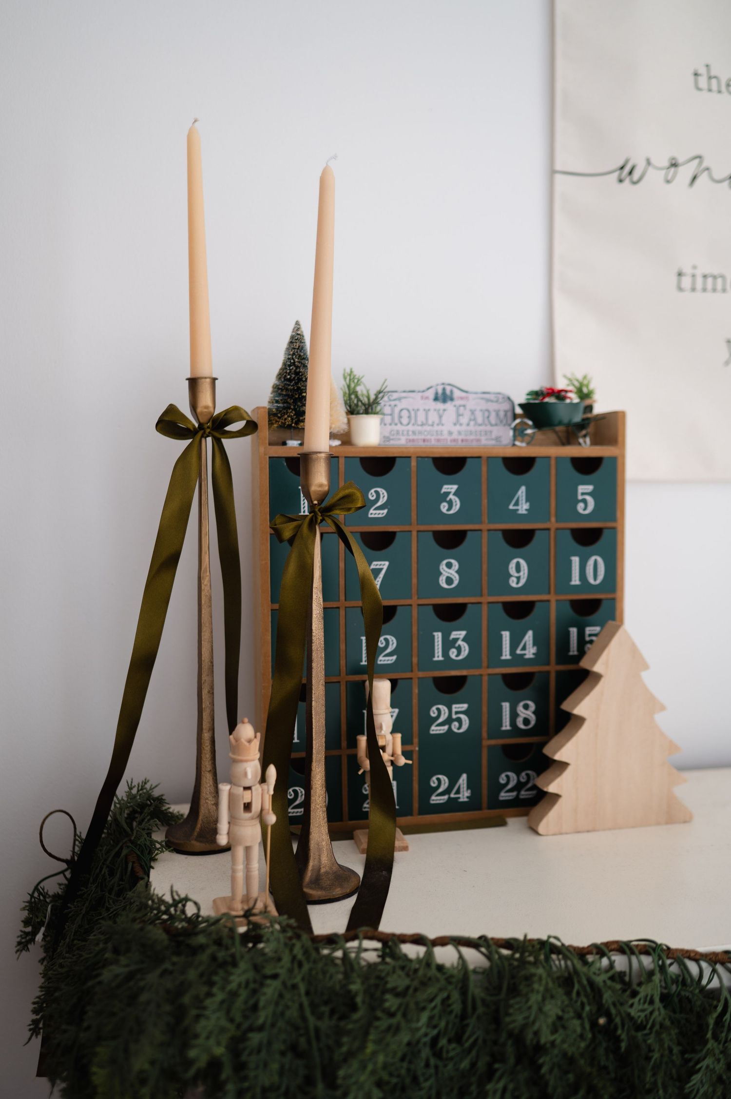 Advent calendar and candlesticks on a white mantle at The Photo Space Christmas pop-up designed by B Del Bosque Photography