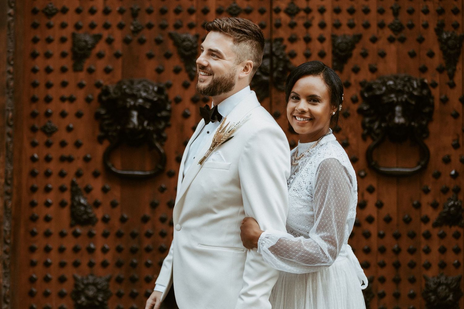 Couple sharing a romantic moment in the mountains along a winding road during a photo session.