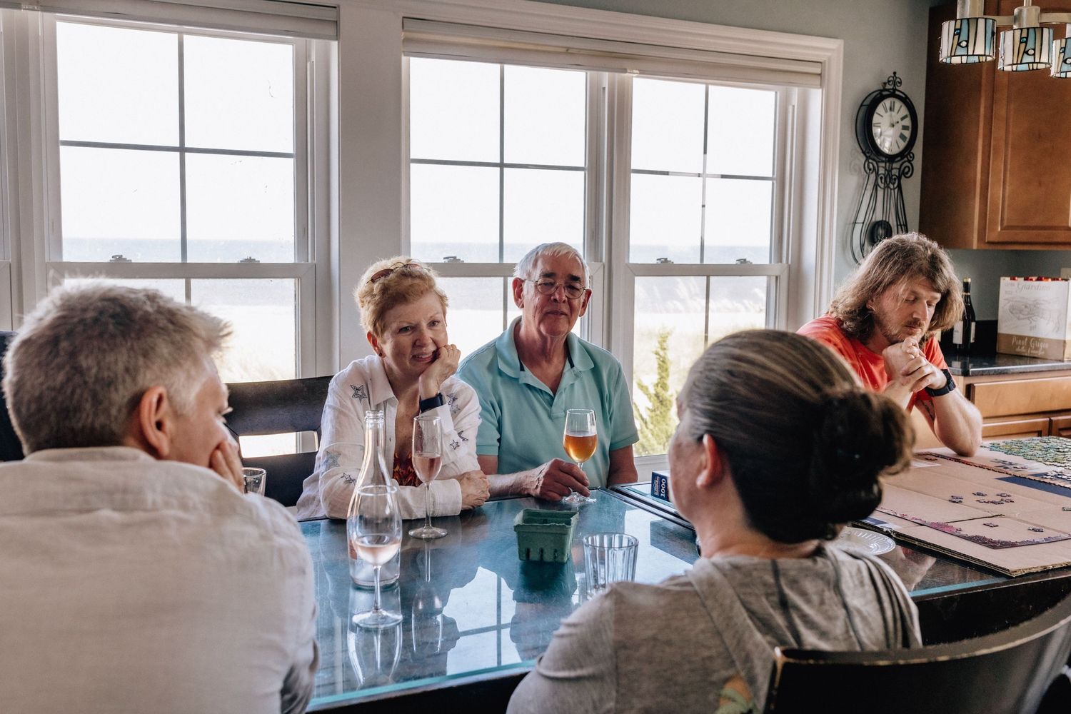 grandparents and family sitting around kitchen table in sandbridge, virginia
