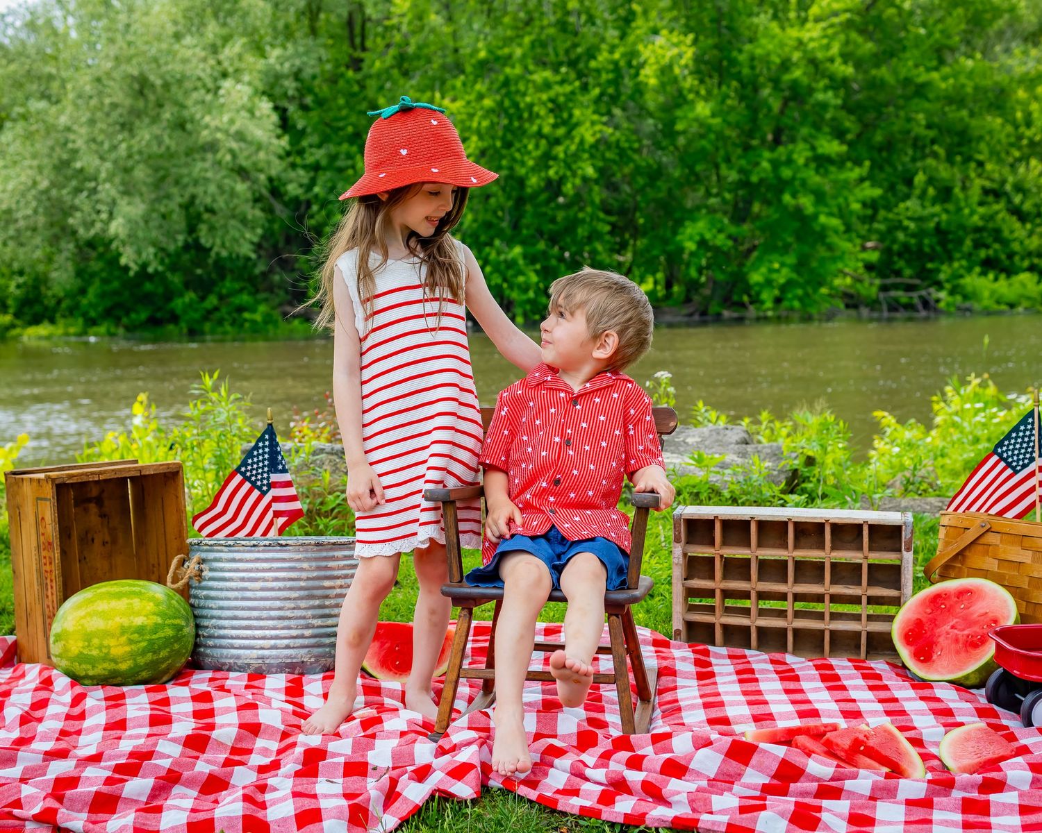Red and white checkered picnic scene with watermelon slices and summer treats laid out on a sunny outdoor table.