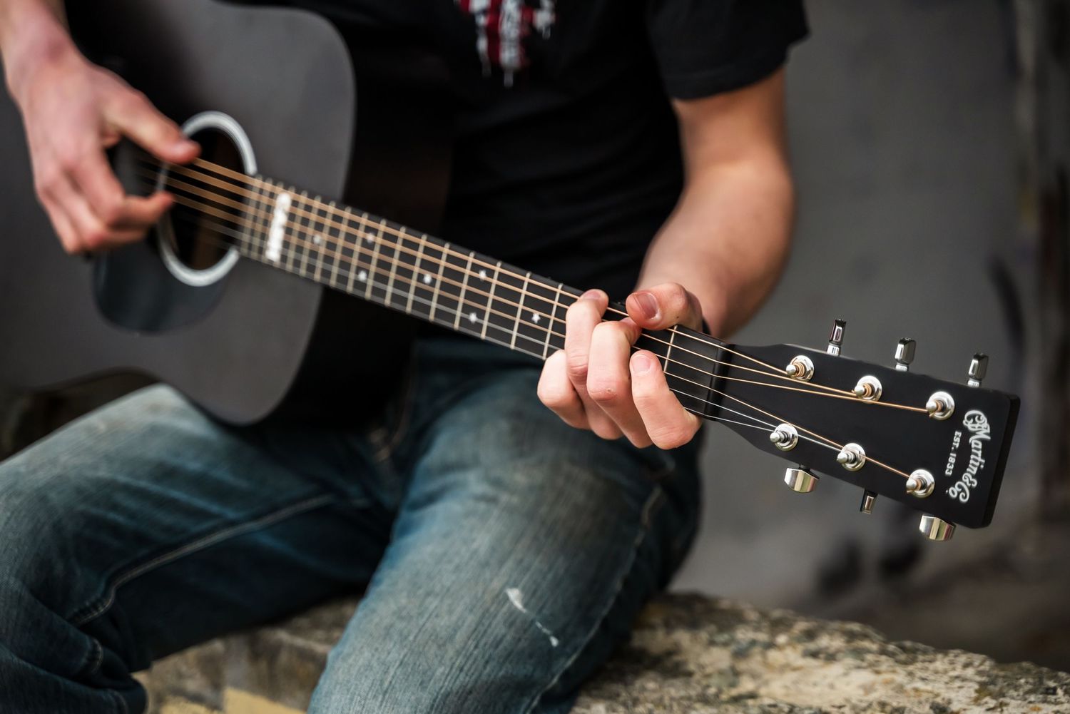 senior guy plays guitar during his photoshoot in mount vernon, wa